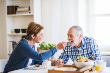 A senior couple sitting having breakfast