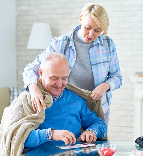 caregiver caring for elder man