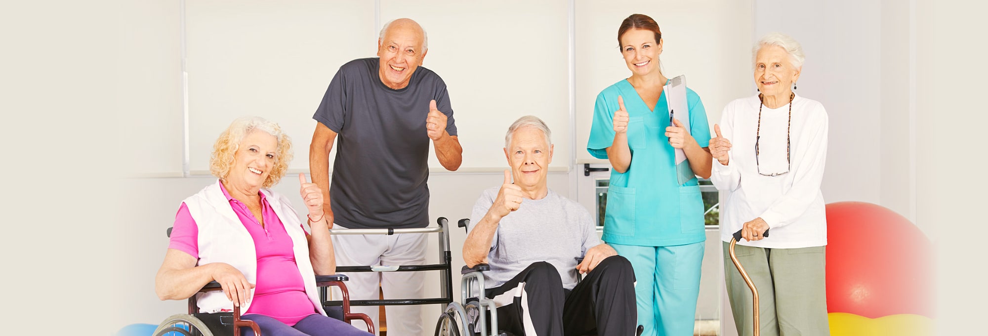 group of elderly people showing their thumbs up