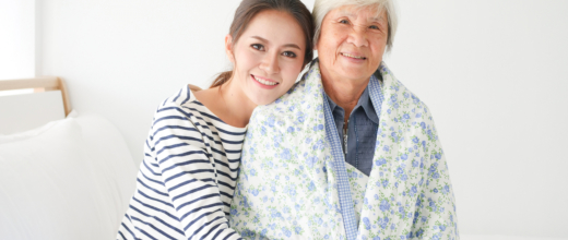 caregiver and elder woman smiling